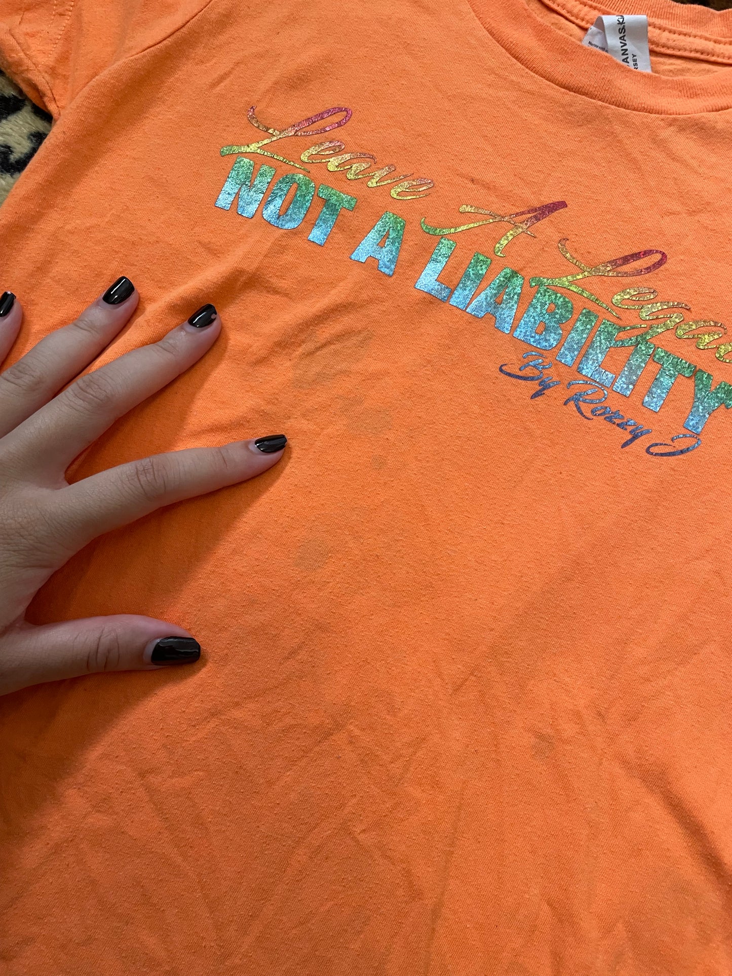 love a legacy not a liability slogan baby tee